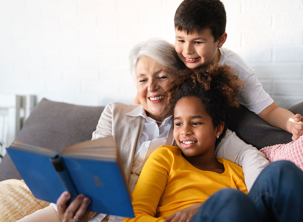 Grandmother reading to grandkids