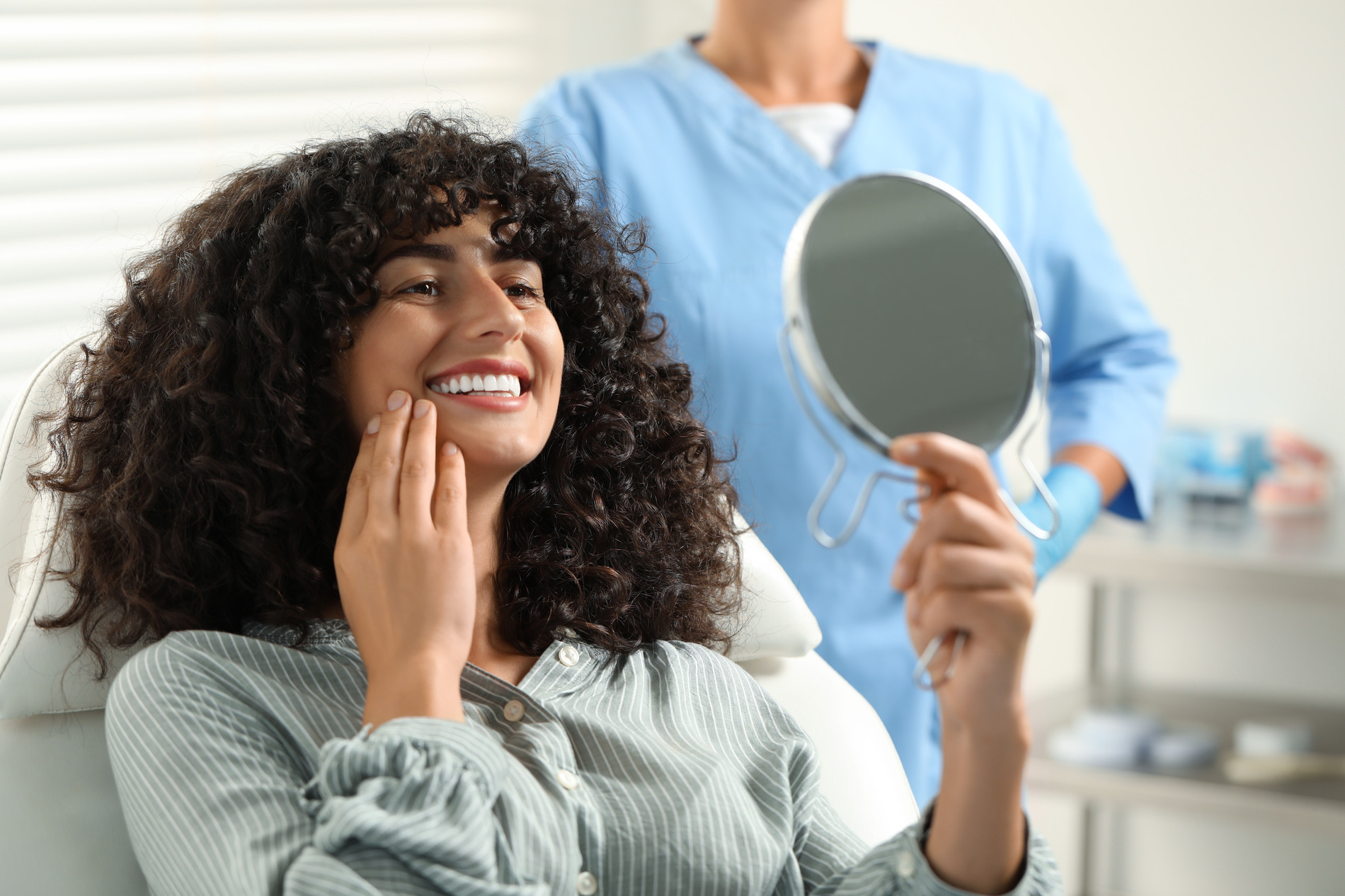 Woman excited about her smile makeover at Jensen Family Dental