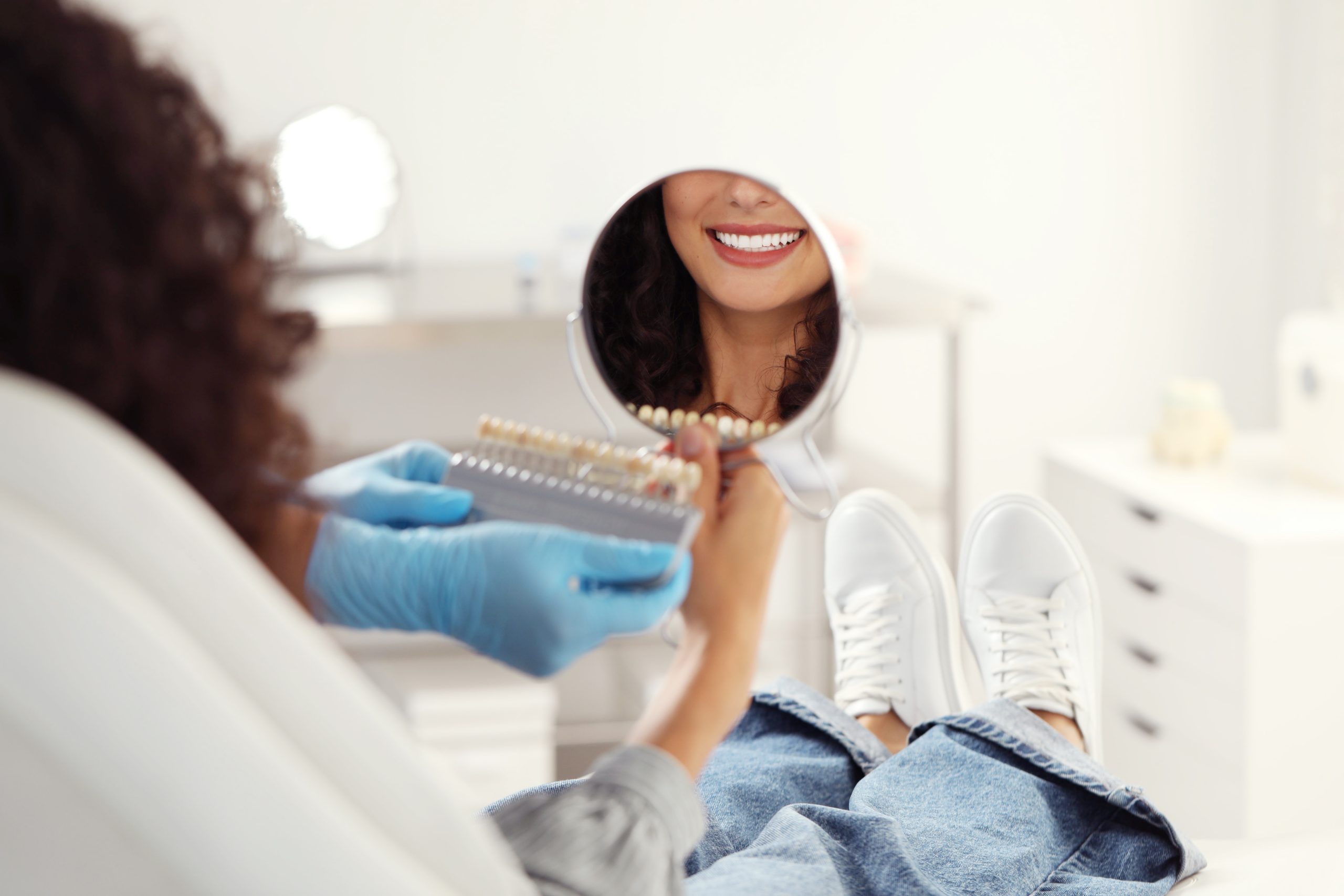 female dental patient smiling during cosmetic dental consultation at jensen family dental